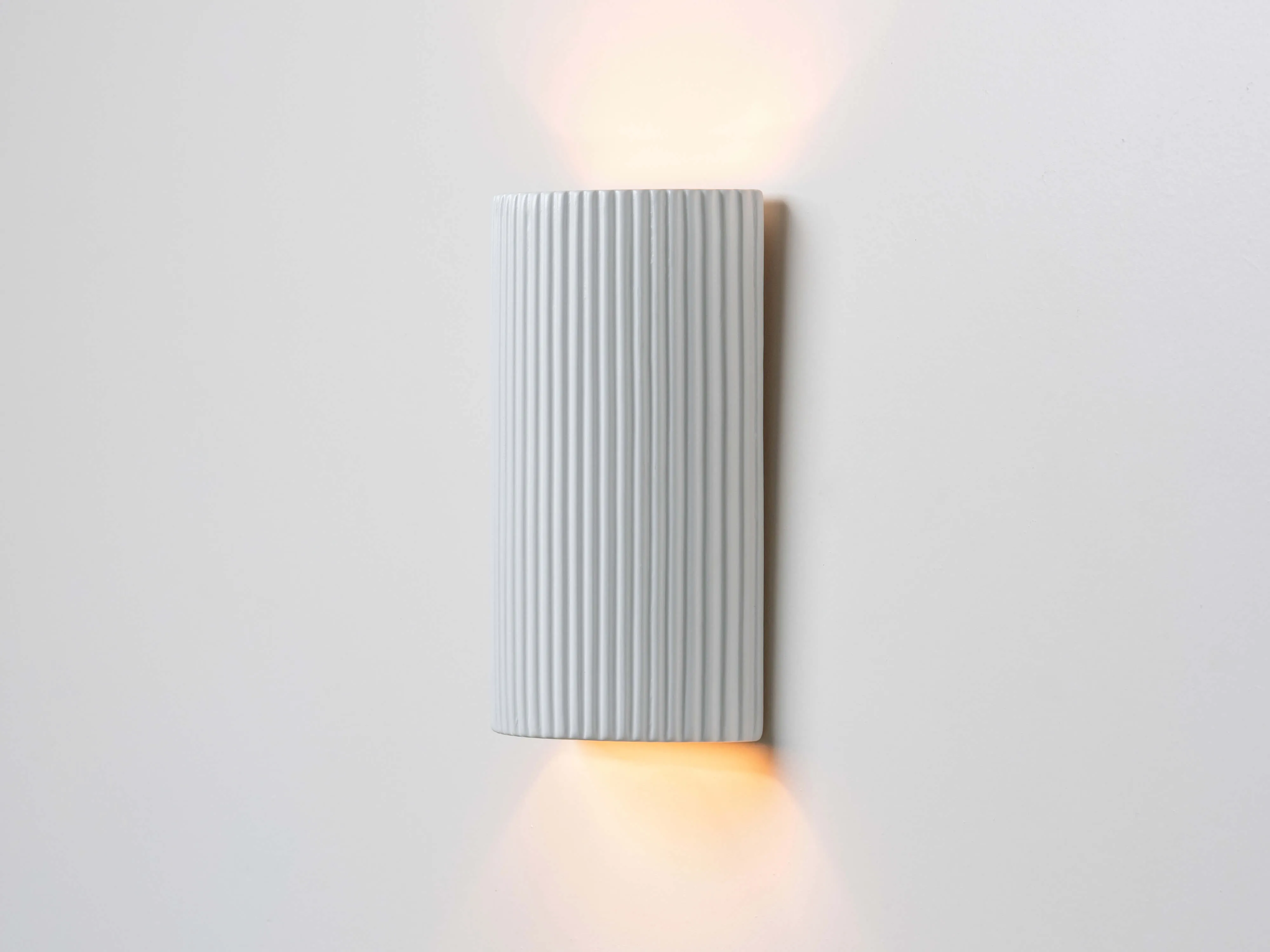 White ribbed ceramic pillar wall light